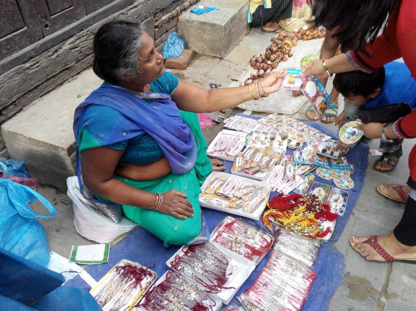 Women selling rakhi in streets of Kathmandu for Raksha Bandhan.
